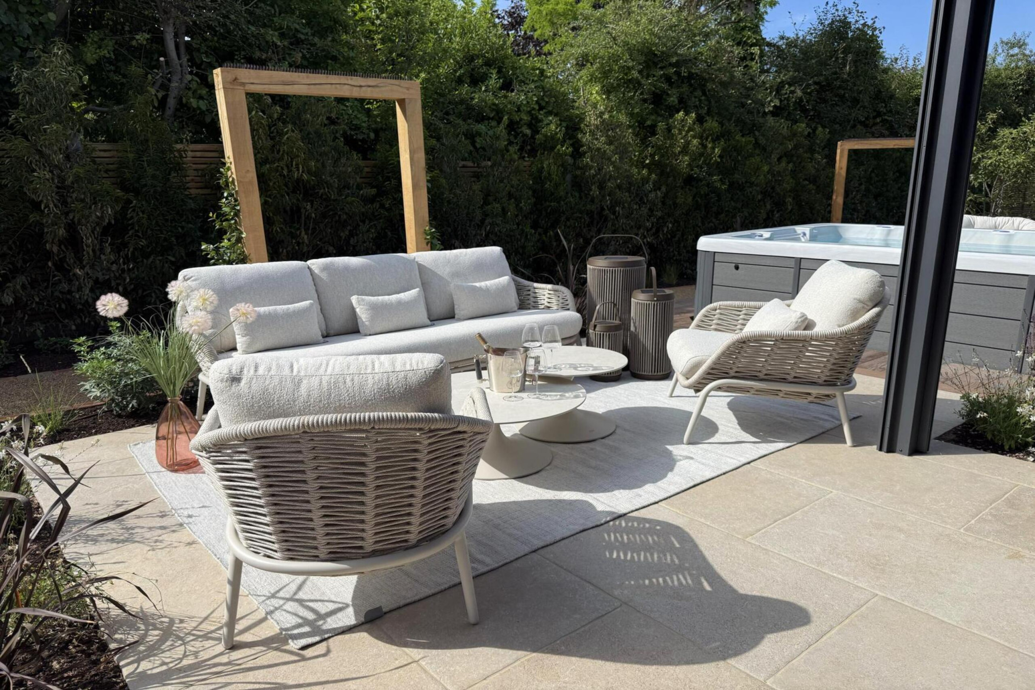 Garden transformation in Corbetts Avenue, Upminster. Essex. Features include: porcelain paving, clay pavers, louvered pergola, outdoor kitchen, swim spa, rain arch, lighting, planting, turf, resin, Irrigation. Garden design and lanscape transformation by The Essex Garden Co.